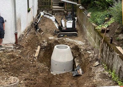 Einsetzen eines Beton-Schachtrings